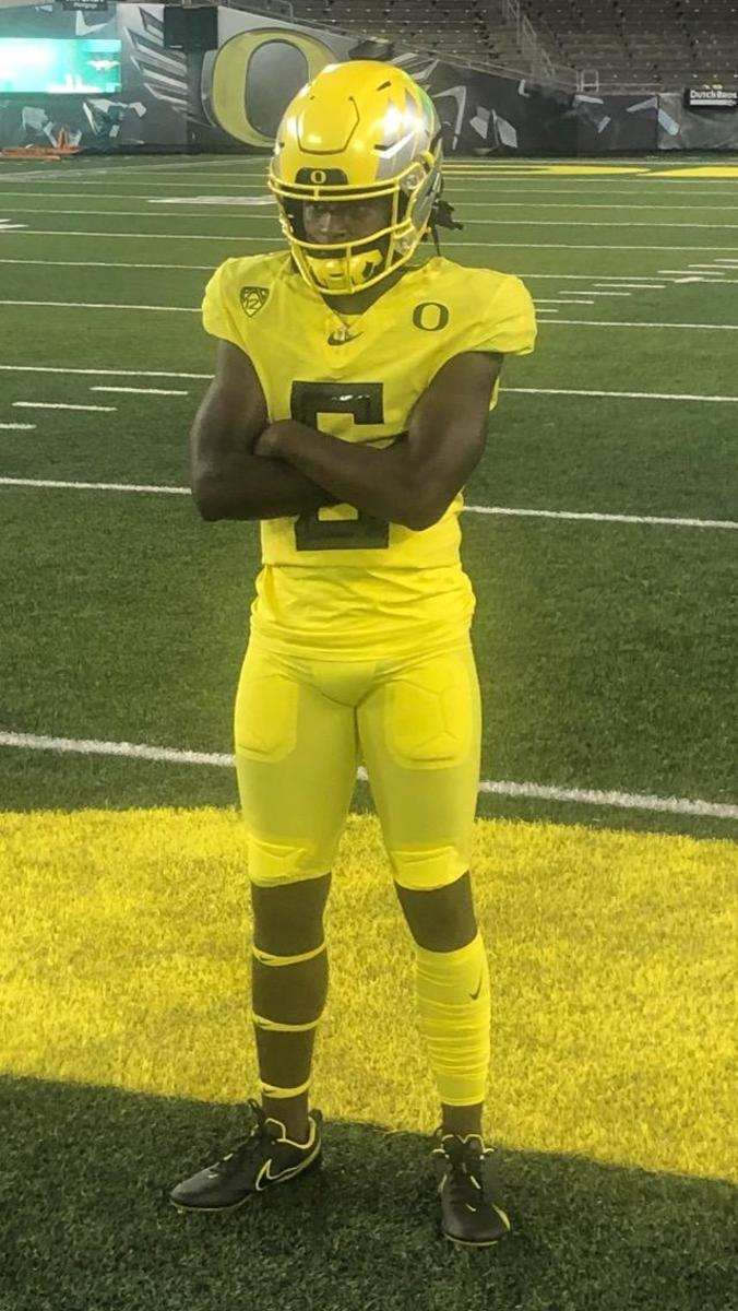 William Watson III poses at midfield at Autzen Stadium.